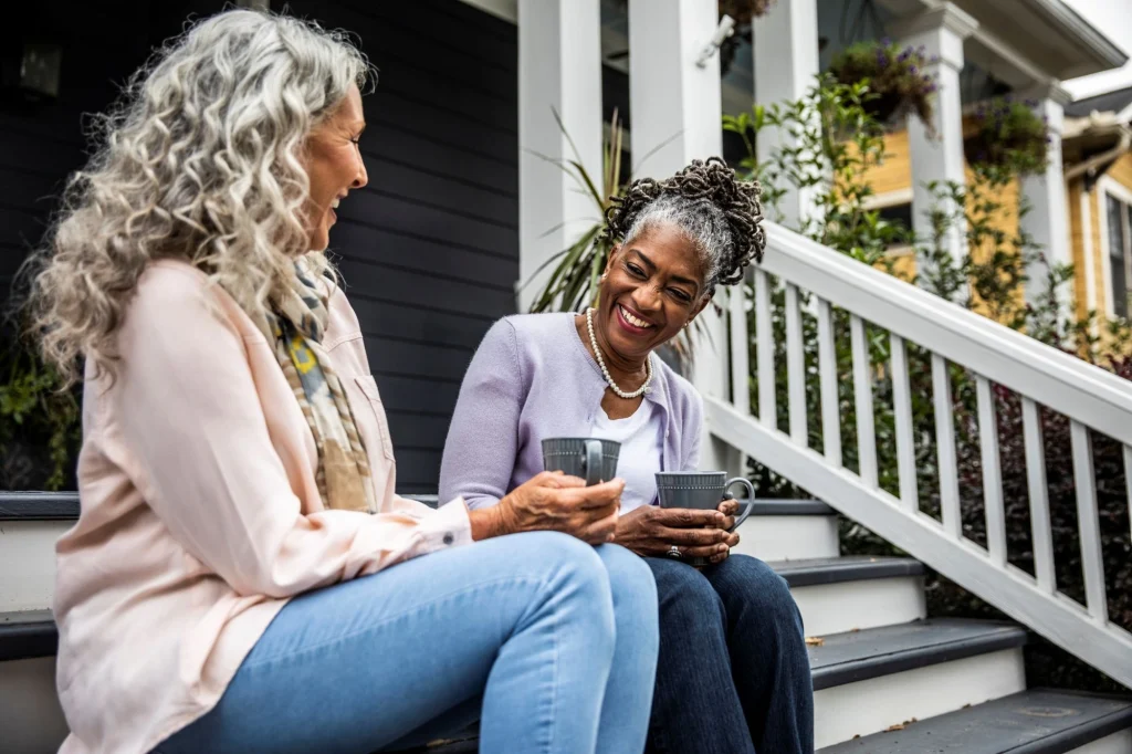 ladies having coffee on front porch of active adult community