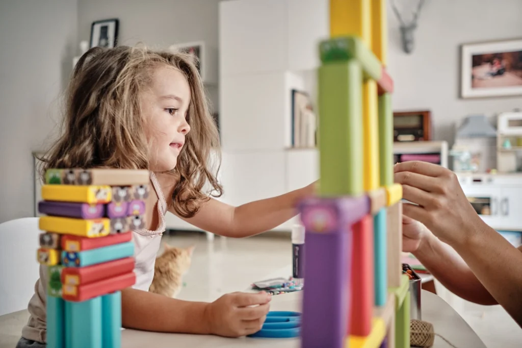 little girl playing with toys