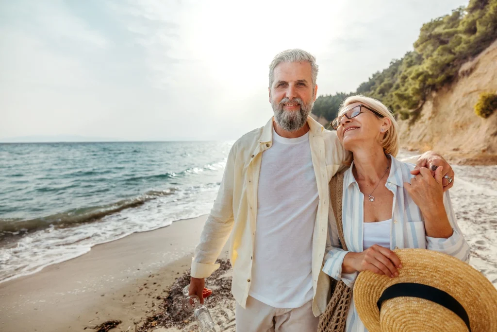 older senior couple on the beach