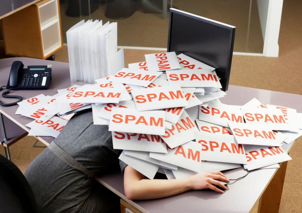 spam lady slumped over desk on computer