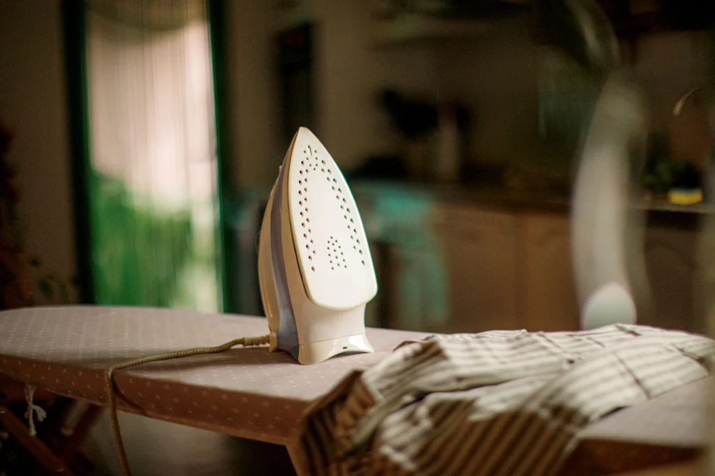 steam iron on a board