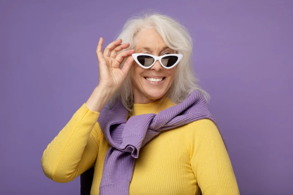 lady in yellow sweater and purple background