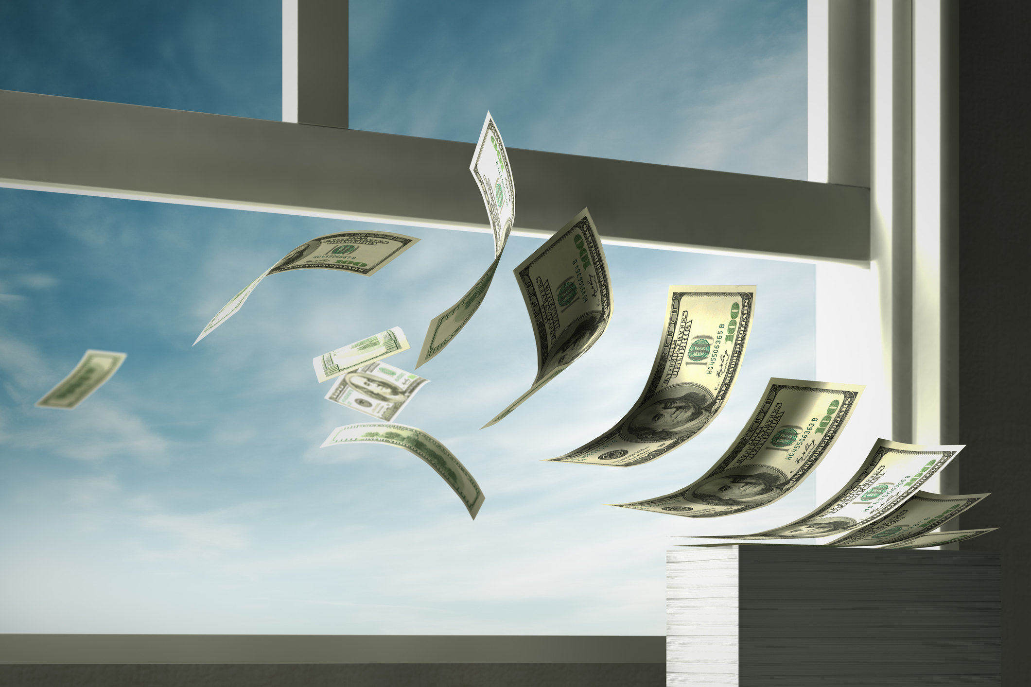 money flying out the window, wasting money