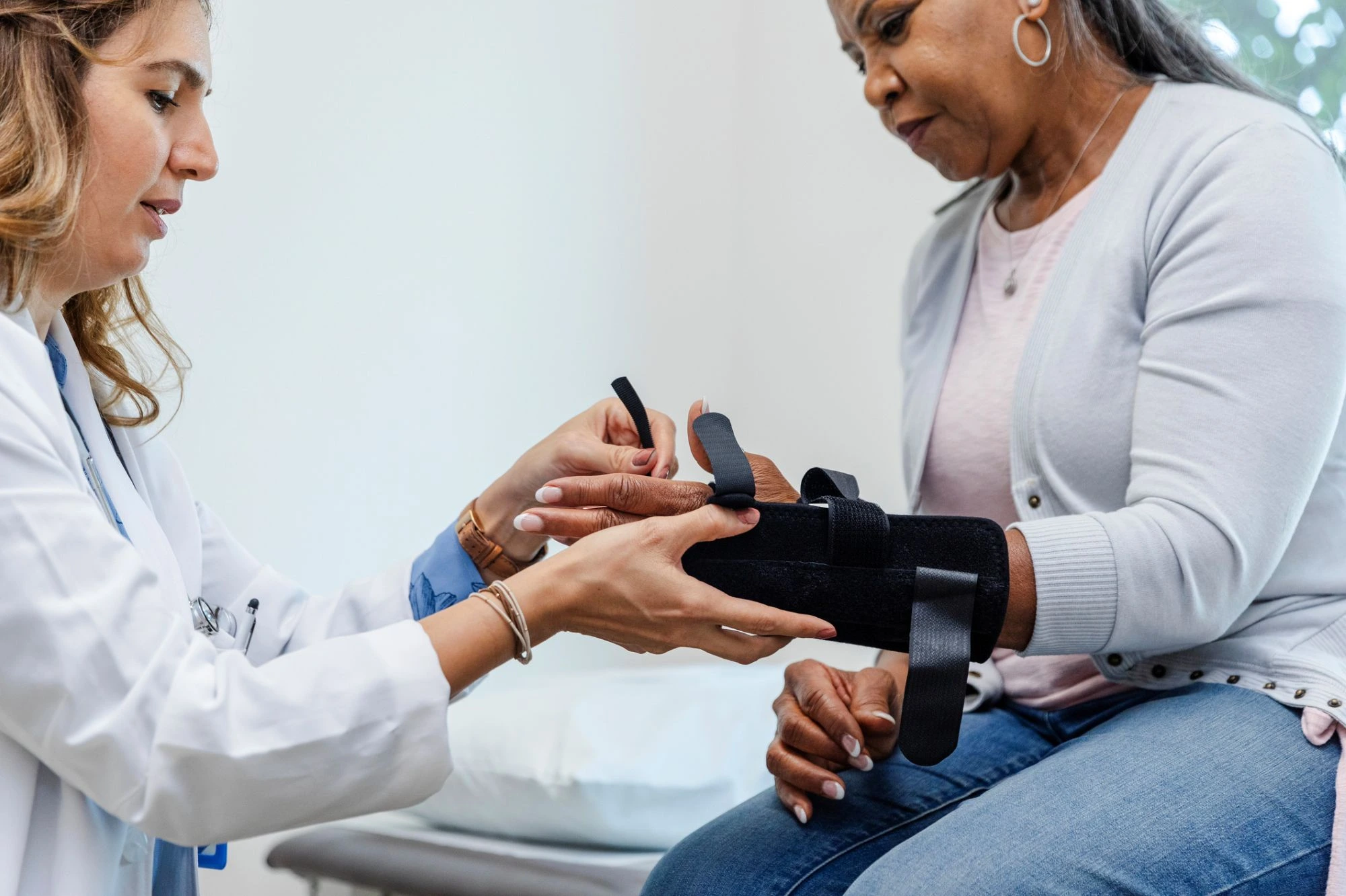 senior lady being fitted for a wrist splint